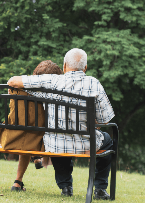couple sitting on a park bench